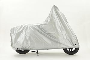 A motorcycle covered with tarp
