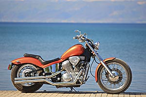 A bike parked on a breathtaking beach