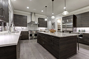 A beautifully remodeled kitchen with stainless steel appliances and large island