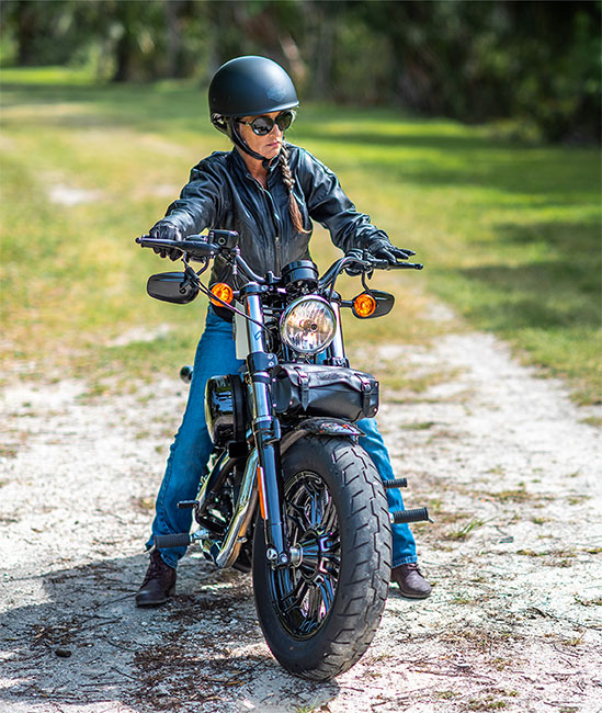 A motorcylist on a off the beaten path