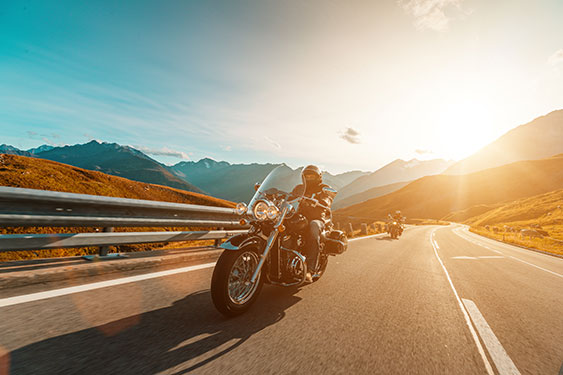 A biker navigating through snow covered mountains